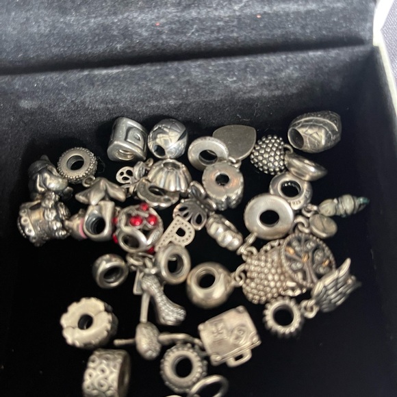 Lot of 26 Authentic Pandora charms.